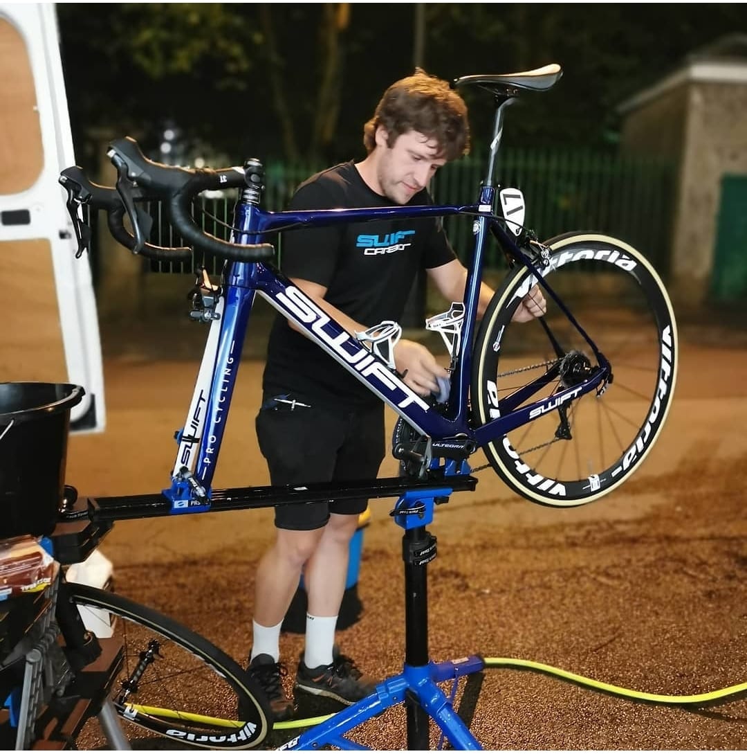 Bike mechanic working on a race bike
